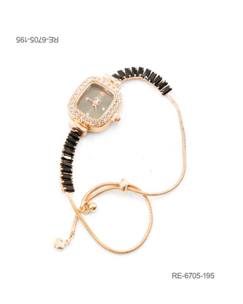 Reloj de pulsera para mujer de diseño elegante en color dorado, con caja rectangular de bordes redondeados con fondo oscuro ornamentada con un cerco de pedrería brillante y una correa combinada con cristales rectangulares negros y un sistema de ajuste deslizante RE6705